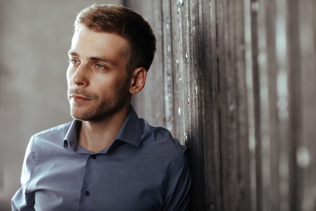 Young handsome businessman posing indoor