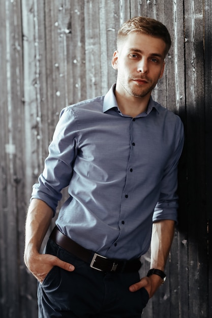 Young handsome businessman posing indoor