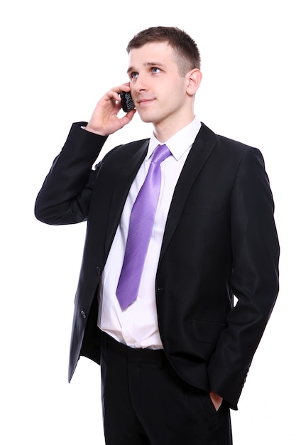 Young and handsome businessman using cellphone