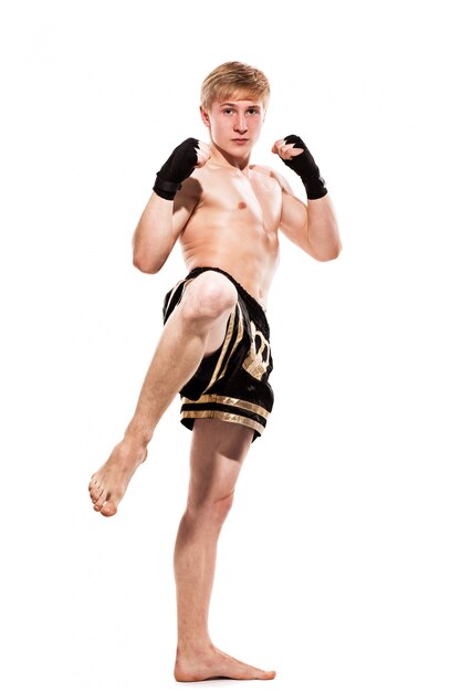 Young handsome fighter in shorts