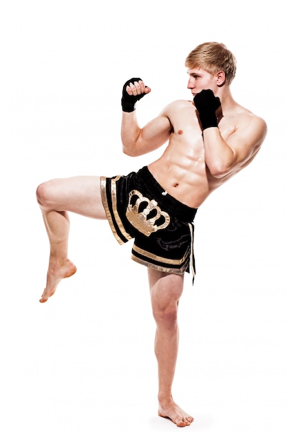 Free photo young handsome fighter in shorts