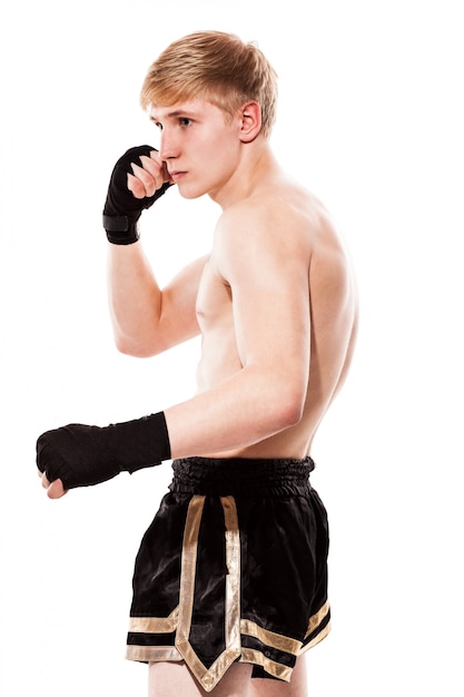 Young handsome fighter in shorts