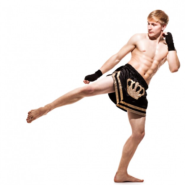 Young handsome fighter in shorts