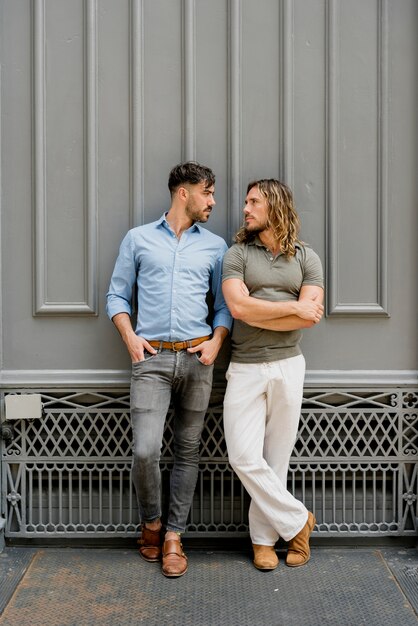 Young handsome males posing together