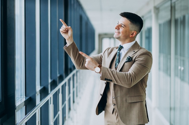 Free photo young handsome man alone at the office