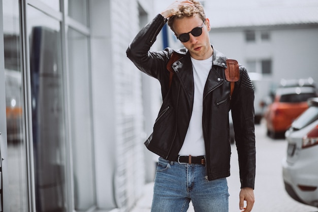 Young handsome man model posing in the street