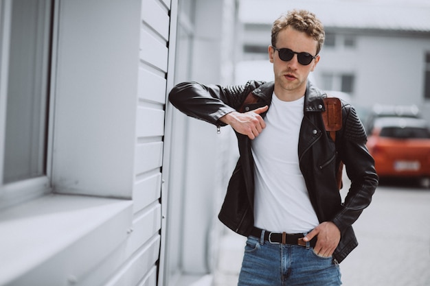 Free photo young handsome man model posing in the street