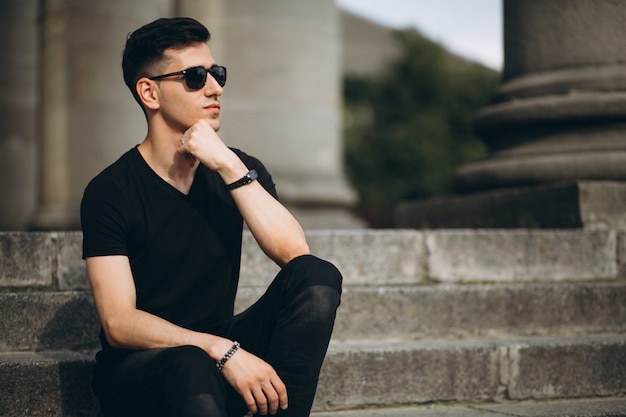 Free Photo | Young handsome man sitting on stairs