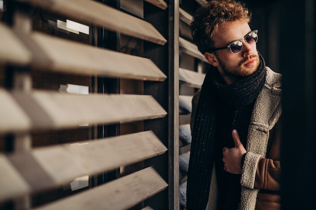 Young handsome man in a street outfit