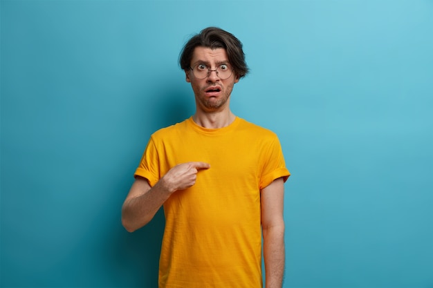 Young handsome man student with trendy hairstyle isolated