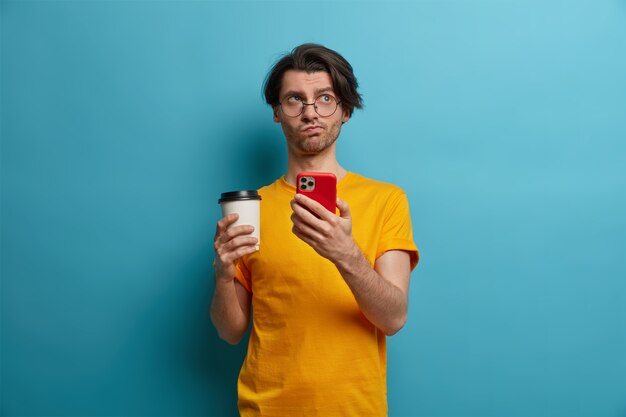 Young handsome man student with trendy hairstyle isolated