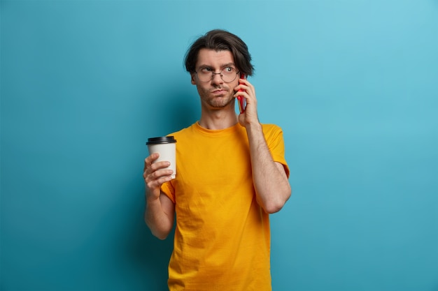 Young handsome man student with trendy hairstyle isolated