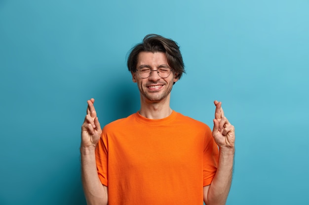 Young handsome man student with trendy hairstyle isolated