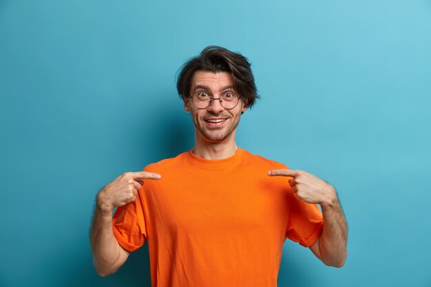 Young handsome man student with trendy hairstyle isolated