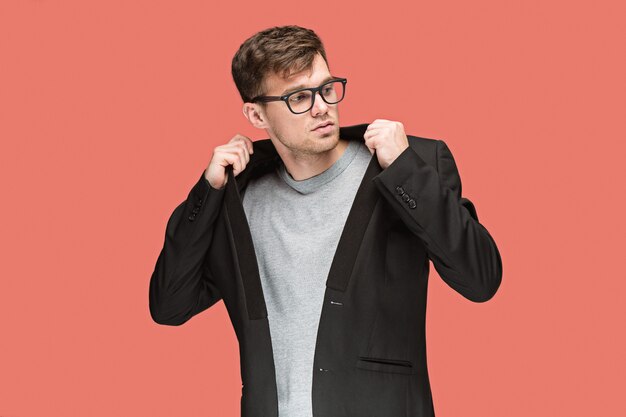 Young handsome man in suit and glasses