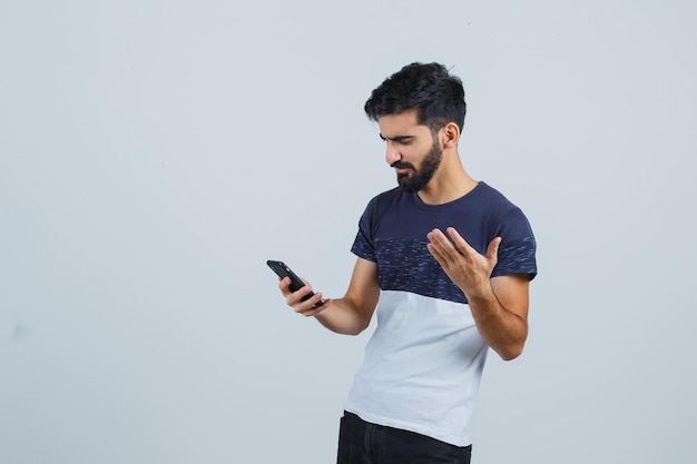 Young handsome man using a phone