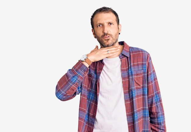 Free photo young handsome man wearing casual clothes cutting throat with hand as knife, threaten aggression with furious violence