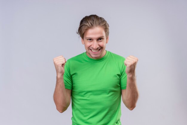 Young handsome man wearing green t-shir