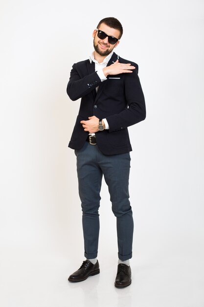 Young handsome stylish hipster man in black jacket, business style, white shirt, isolated, standing on white background, smiling, attractive, full height, looking confident and cool