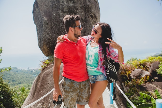 Young happy hipster couple in love traveling around world