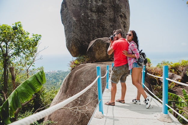 Free photo young happy hipster couple in love traveling around world