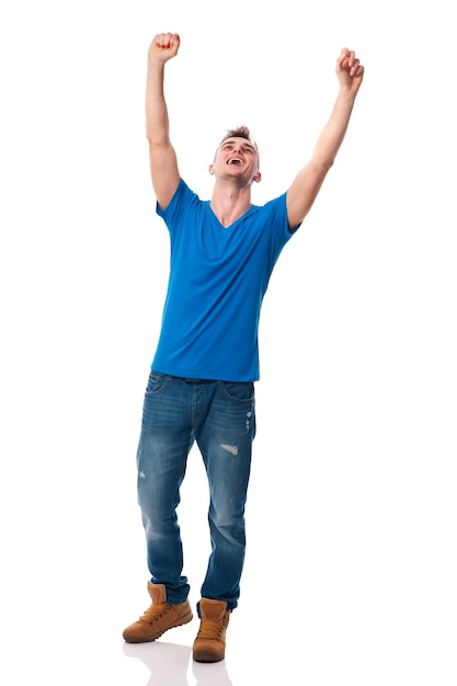 Young happy man celebrating success