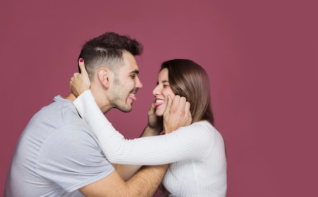 Young happy man having fun with attractive smiling woman