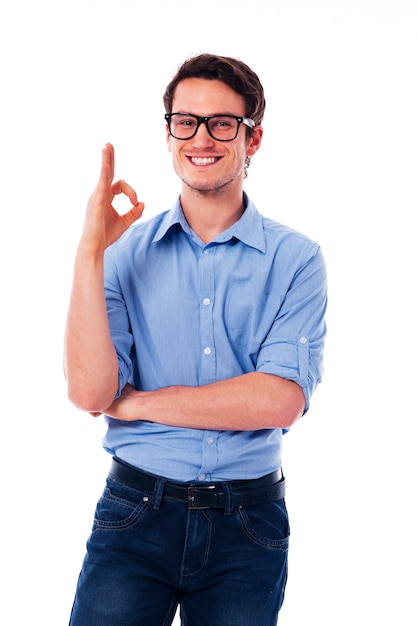 Young happy man showing ok sign