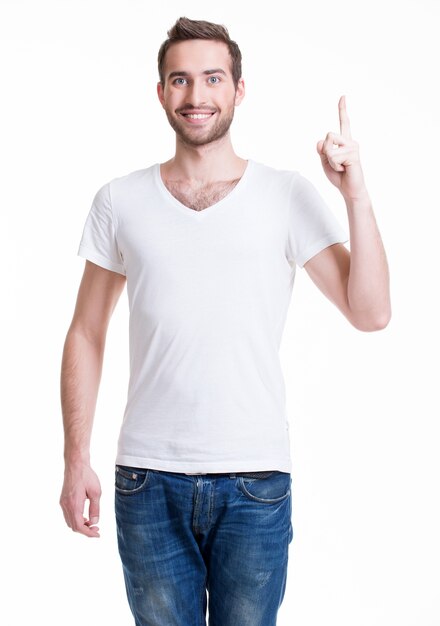 Young happy man with good idea sign  in casuals isolated