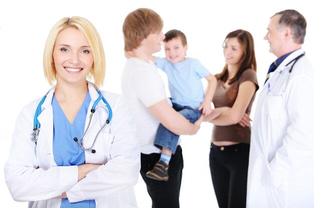 Young happy successful female doctor and the young family with the little son