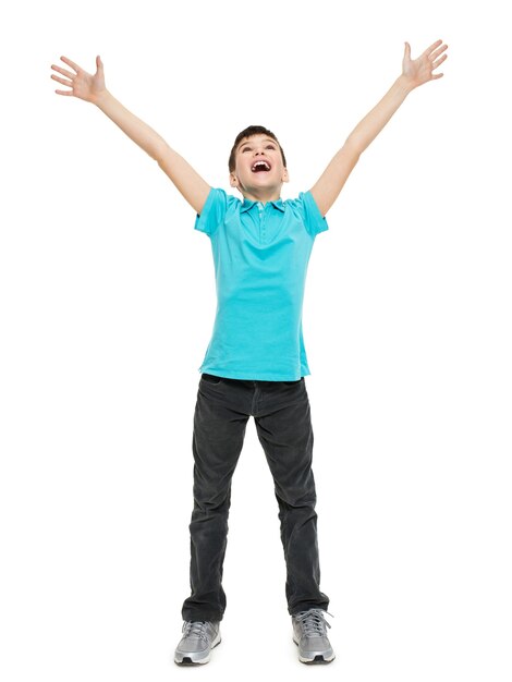 Young happy teen boy with  in casuals with raised hands up isolated on white.