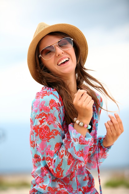 Young and happy woman on the beach