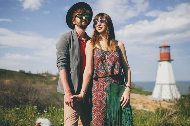 Young hipster couple posing in the countryside