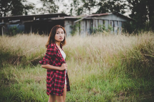 Young hipster girl in the summer field.