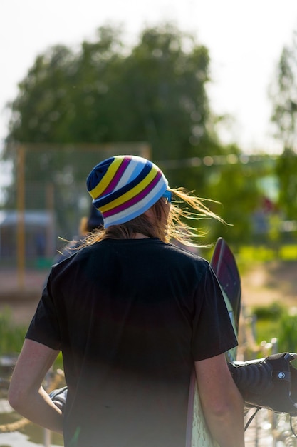 Young hipster man in colorful striped hat