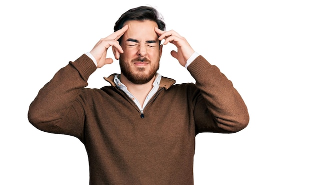 Young hispanic man wearing casual clothes with hand on head, headache because stress. suffering migraine.