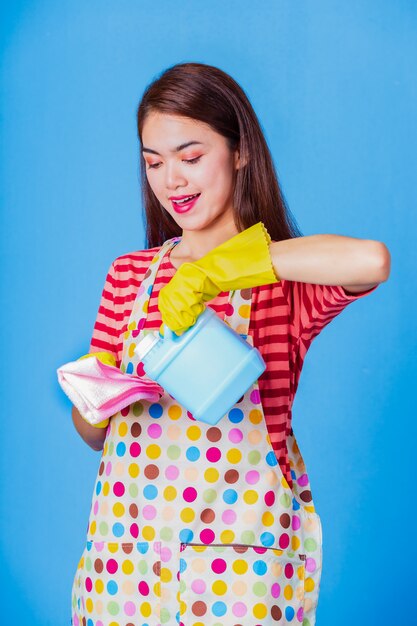 Young housekeeper female with cleaning supply