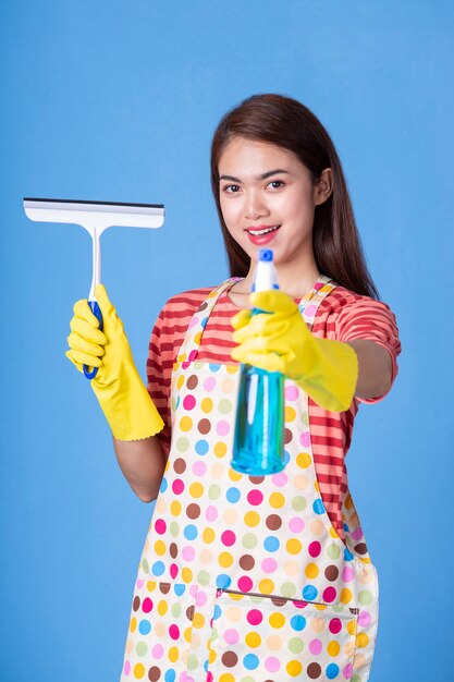 Young housekeeper female with cleaning supply