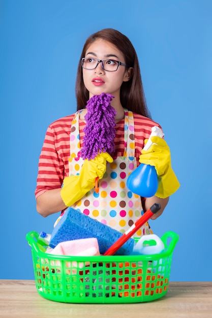 Young housekeeper female with cleaning supply