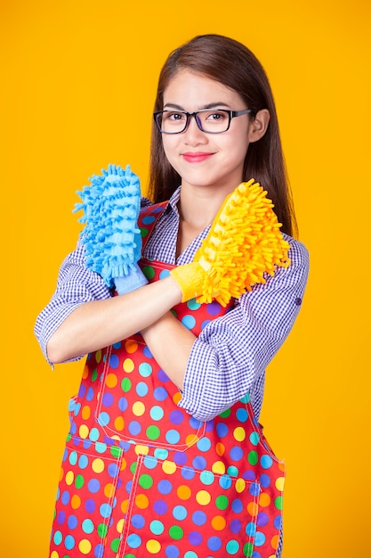 Young housekeeper female with cleaning supply