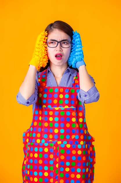 Young housekeeper female with cleaning supply