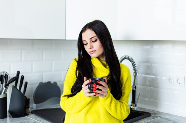 Young illness woman drinking tea at home.