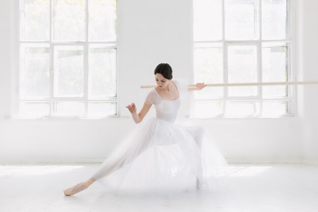Young and incredibly beautiful ballerina is posing and dancing