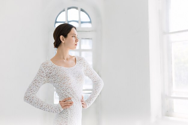 Young and incredibly beautiful ballerina is posing and dancing