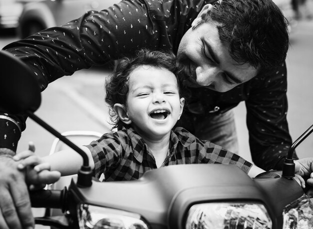 Young Indian boy riding the motobike