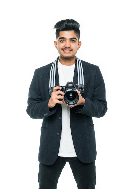 Young indian man with camera isolated over white background