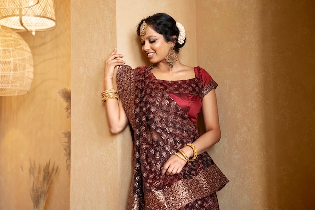 Free photo young indian woman wearing sari