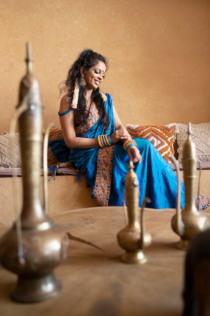 Free photo young indian woman wearing sari