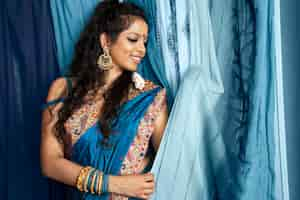 Free photo young indian woman wearing sari