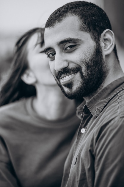 Young international couple together in park